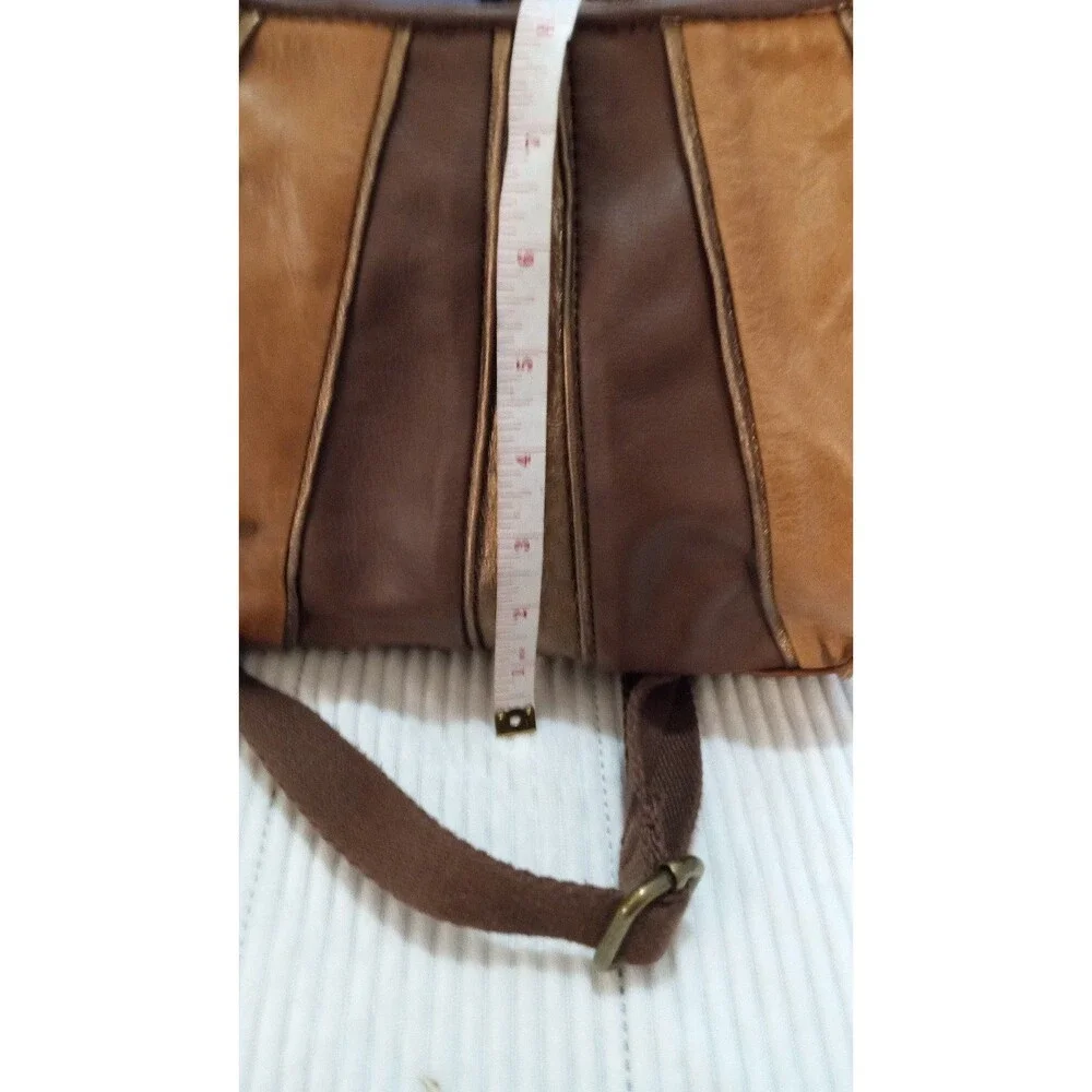 The Sak Crossbody Purse Cognac – Multi-Panel Metallic Detail.
